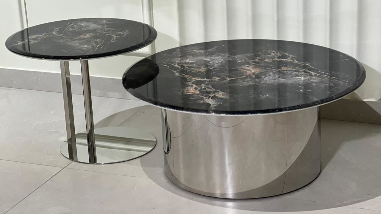 Two marble top tables with metal bases
