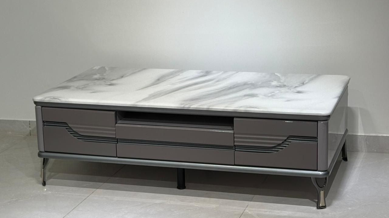 Rectangular grey center coffee table with wave-groove drawers and veined marble top

