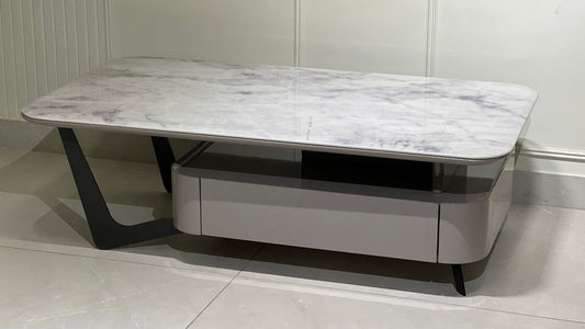 Rectangular luxury center coffee table with marble top and taupe body featuring hidden storage and black legs