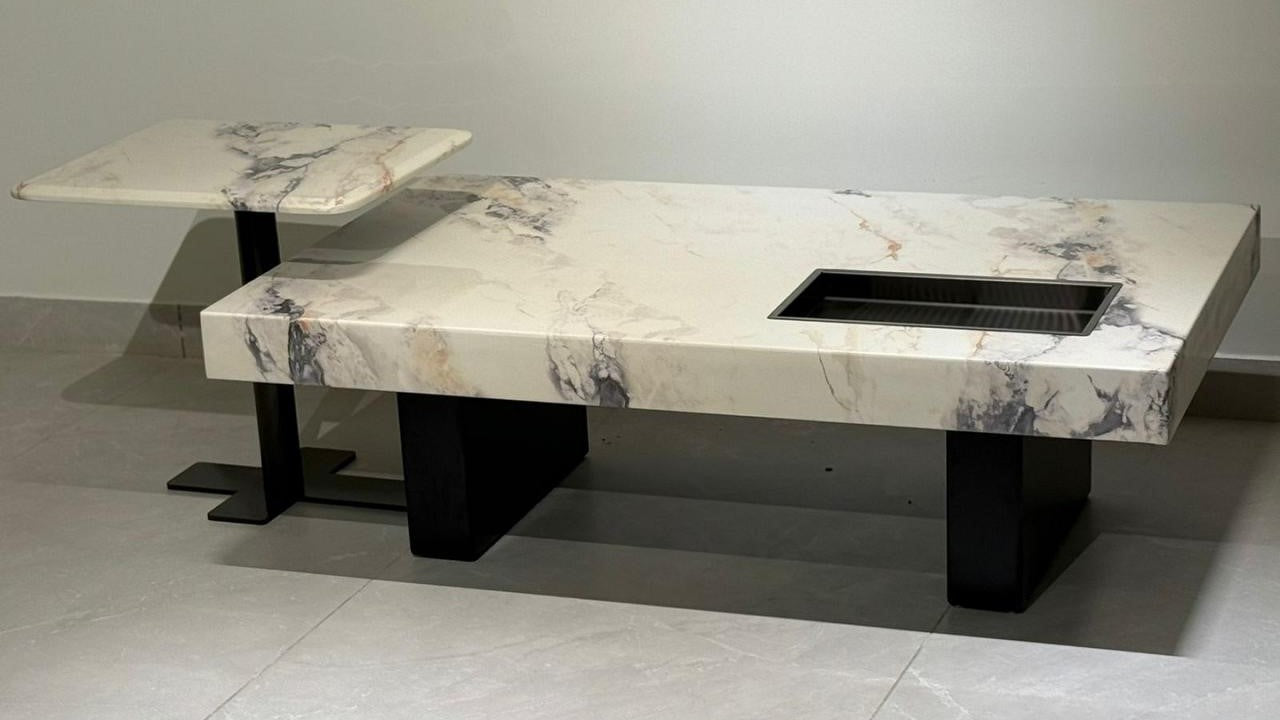 luxury rectangular marble center coffee table with cream veining and black base

