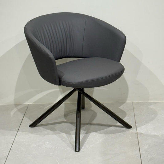 Modern curved-back chair in grey leatherette