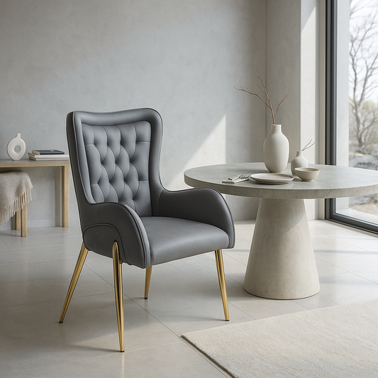 Grey wingback accent chair with tufted backrest and gold legs