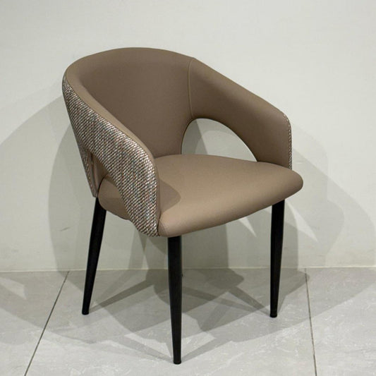 Modern upholstered dining chair in beige with curved backrest