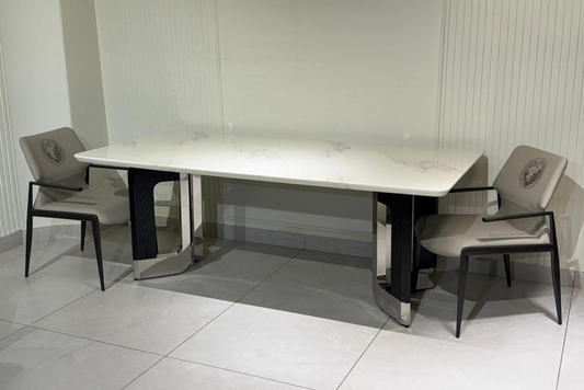 Trion Split Marble Dining Table: premium white marble slab, dual split pedestals in chrome-black. 8-seater for luxury apartments and designer homes.