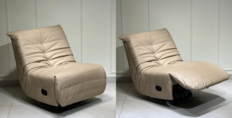 Beige recliner chair with ottoman on a white floor and light gray wall background
