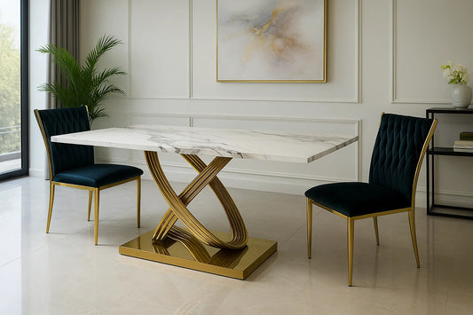 Luxury marble dining table with sculptural gold base and emerald velvet chairs in an elegant contemporary interior.