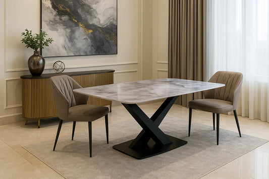 Modern marble dining table with black cross base and taupe upholstered chairs in luxury dining room.