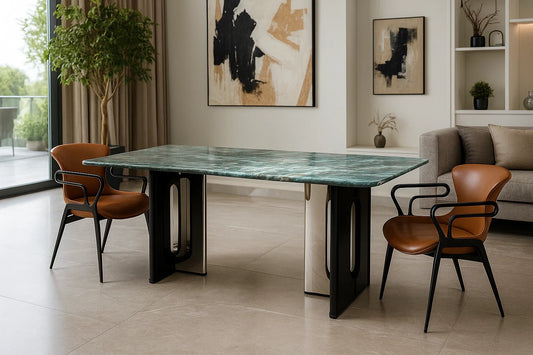 Luxury green marble dining table with sculptural black base and brown leather chairs