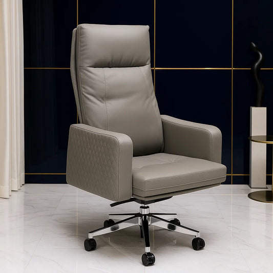 Gray leather office chair with chrome base in a modern interior setting