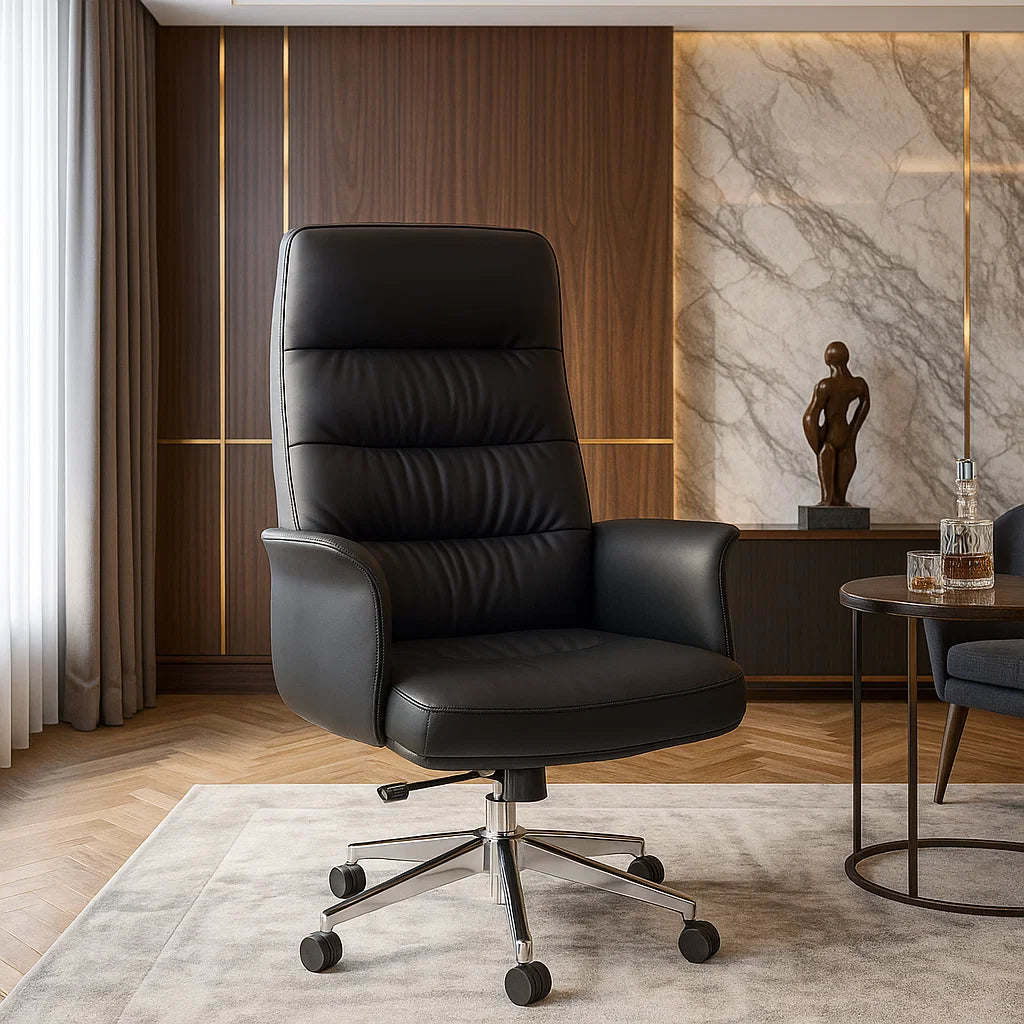 Black leather office chair in a modern office setting with marble wall and table.