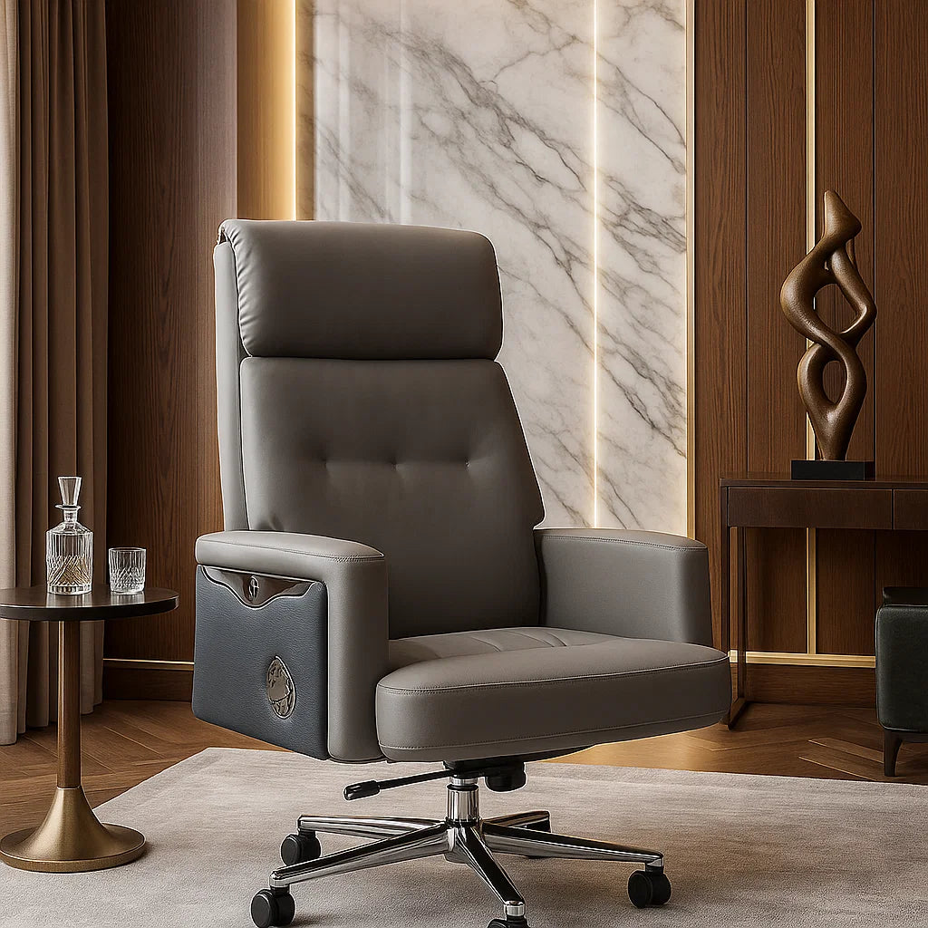 Gray leather office chair in a stylish room with marble wall and decorative sculpture.