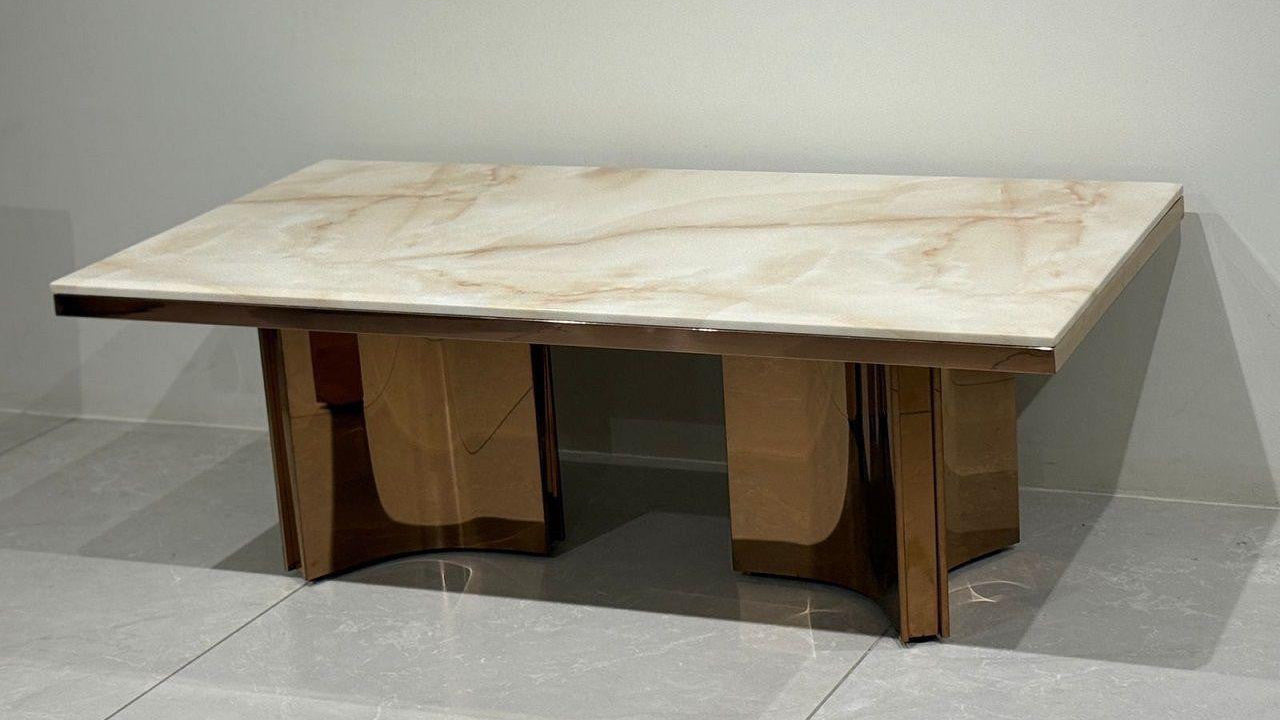Marble-patterned table on a gray floor with a neutral background
