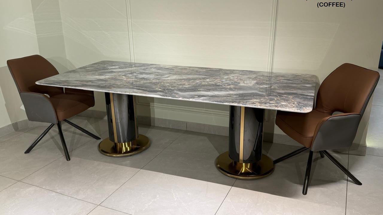 Dining table with marble finish and two chairs in a tiled room