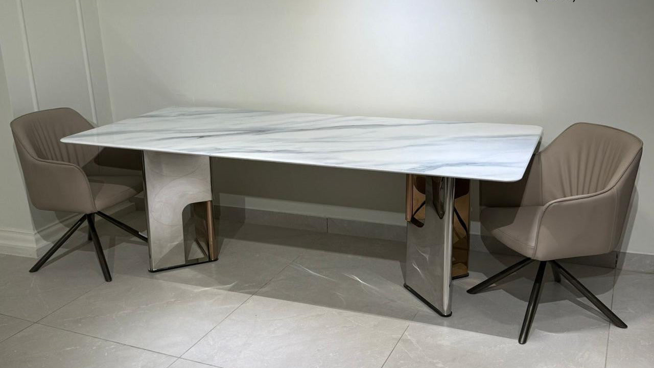 Modern dining table with chairs in a room setting