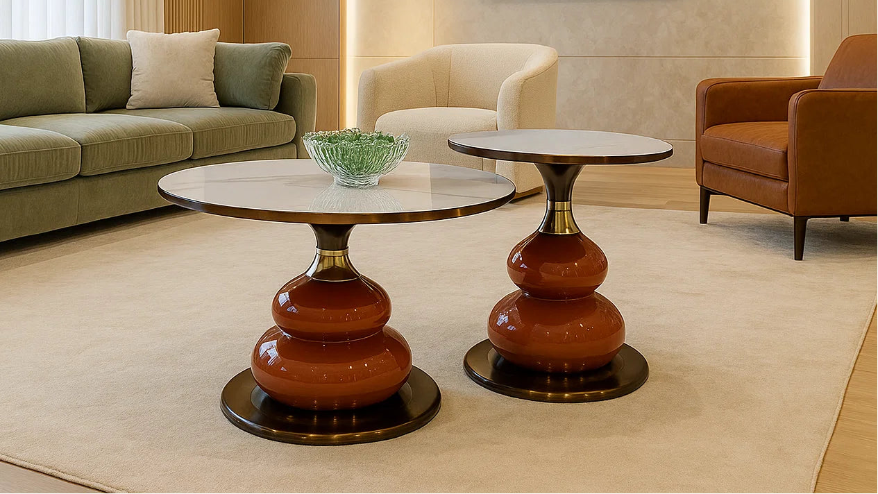 Modern living room with a green sofa, brown armchair, and two round tables.