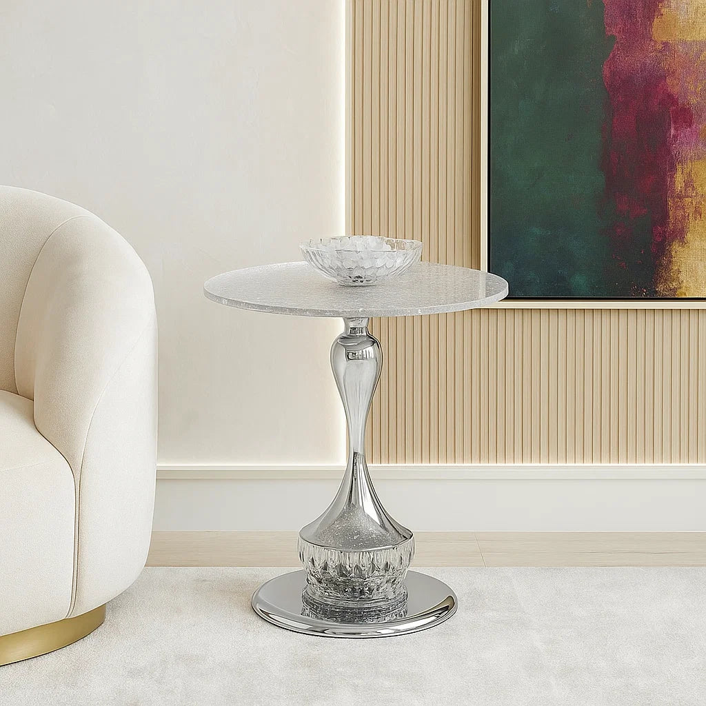 Decorative glass side table in a stylish room with a sofa and abstract painting.